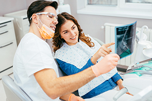 Dentist showing a patient her x-ray
